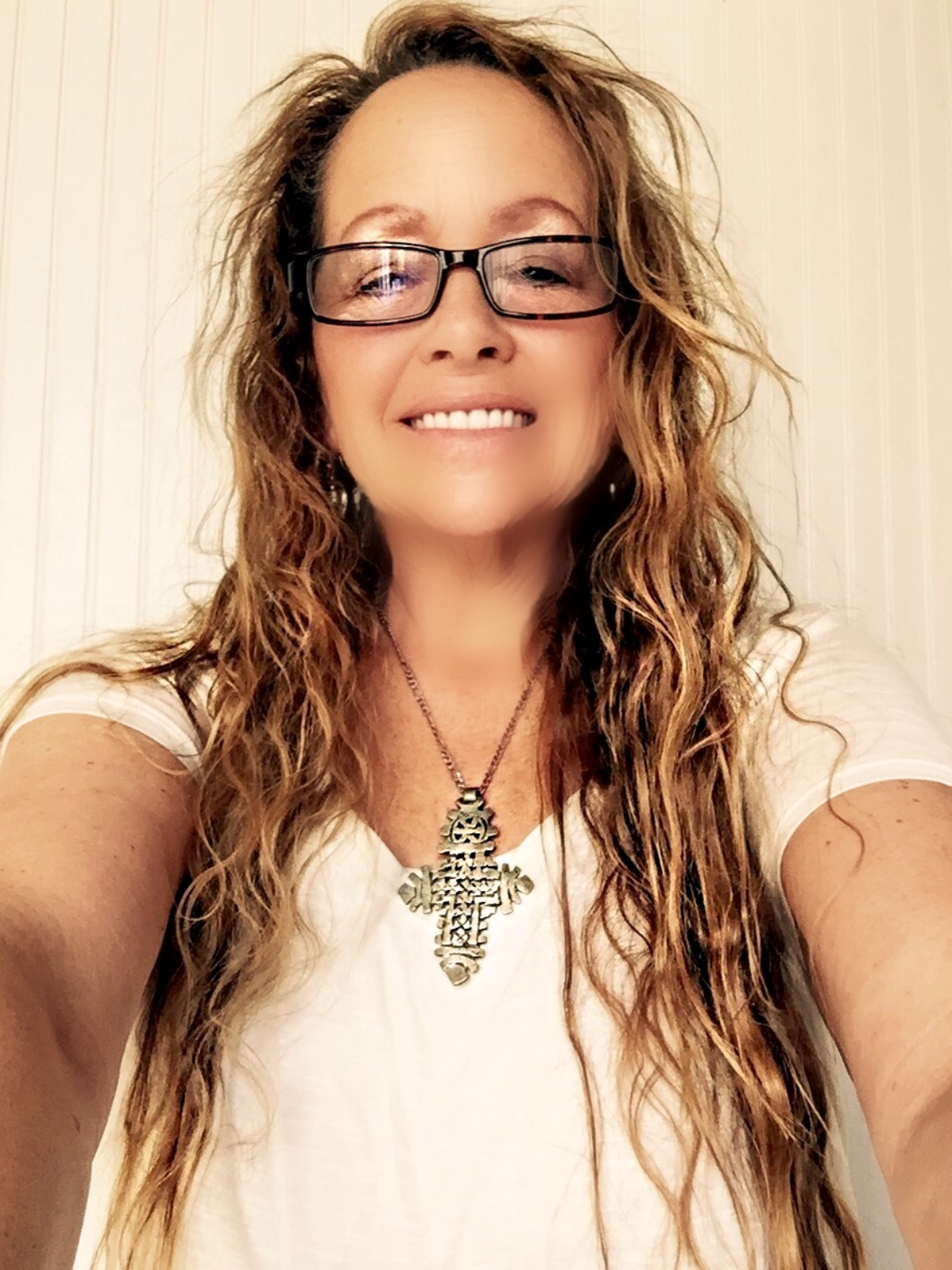 Suzie wearing one of her handcrafted statement pendants
