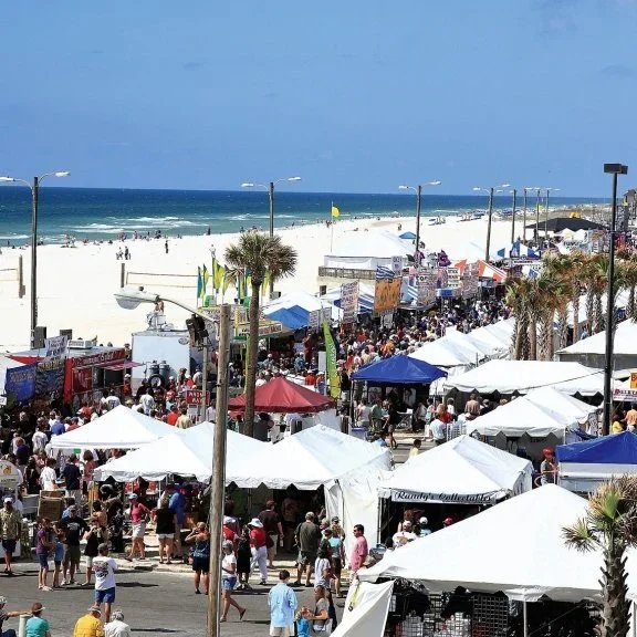 The National Shrimp Festival crowds along the beach in Gulf Shores